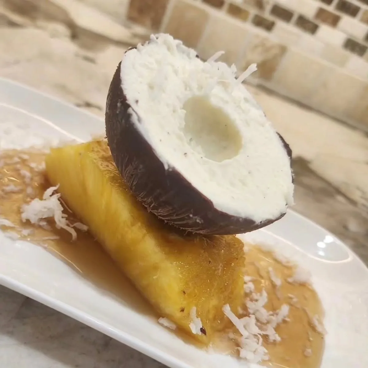 Coconut mousse on caramelized pineapple